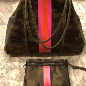 Neoprene bag with Wristlet. Some signs of use with plenty of life left!